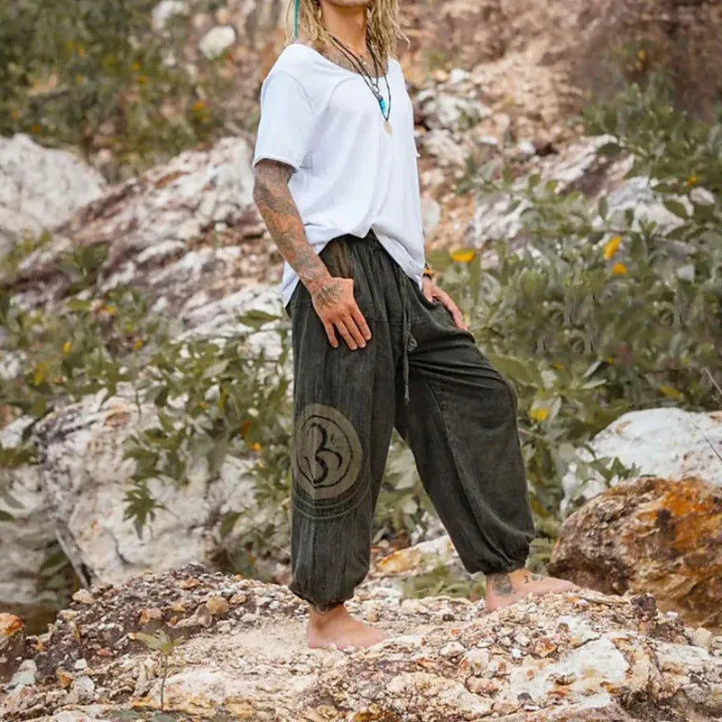 Men's casual trousers with ethnic pattern design, ankle-tied style, mid waist fit, available in dark green colour, made from thin polyester fabric in sizes S to XXXL