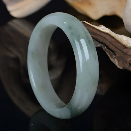 Natural Jinsi Jade Chinese style bracelet showing stone texture, displayed with size options from 52mm to 62mm inner diameter.