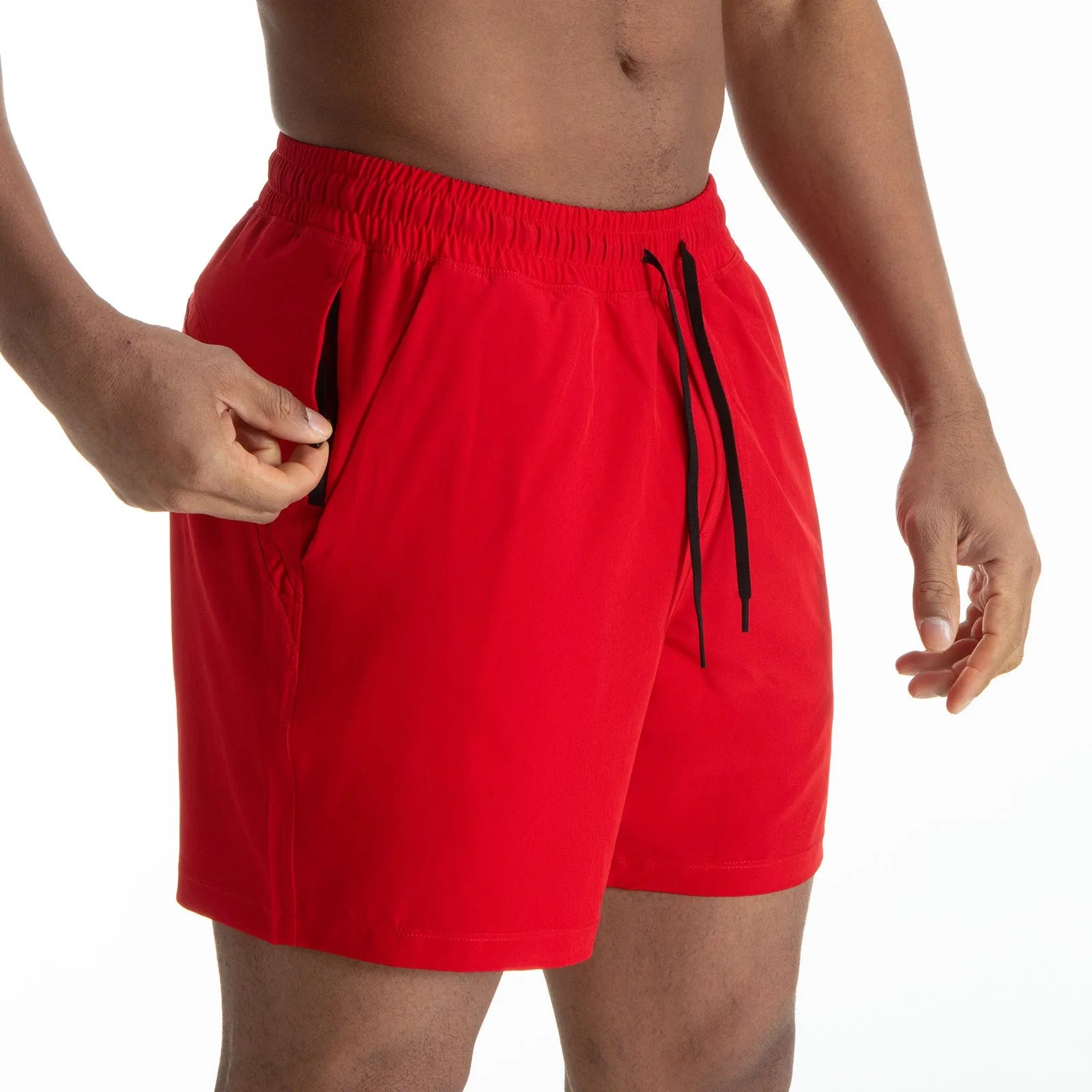 Man wearing black quick-dry polyester sports shorts suitable for running or gym workouts.