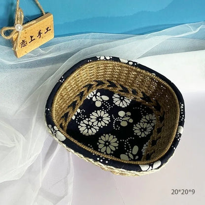Blue square plastic hand-woven storage basket on a tabletop.