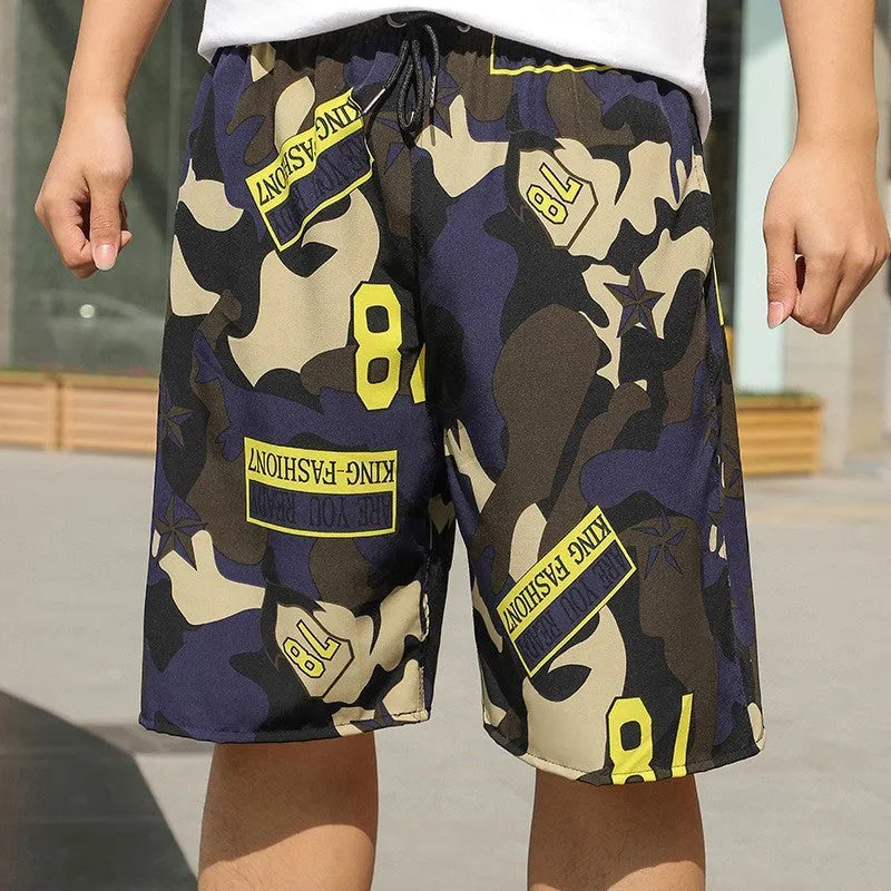 Man wearing loose-fitting striped beach pants made from quick-dry ice silk fabric.