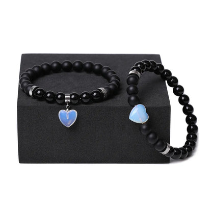 Matching couple bracelets with polished natural stone heart pendants in geometric style