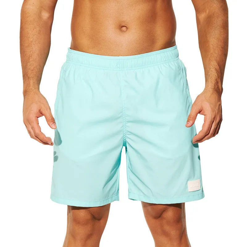 Men's quick-drying nylon beach shorts in four colours with straight leg opening