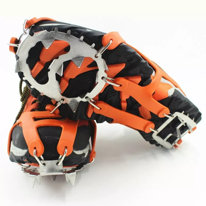 Reinforced large-tooth non-slip shoes in black and orange for superior traction on slippery surfaces