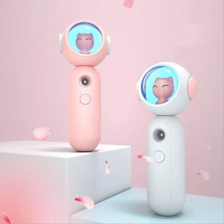 Handheld Nano Spray Steamer in cat pink, cat white, and alien red for portable skin hydration