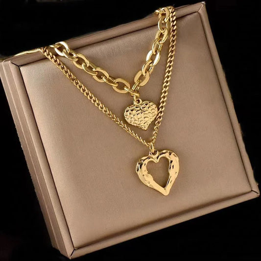 Stylish Titanium Steel Angel Wings Heart Necklace for Women in silver and golden finishes.