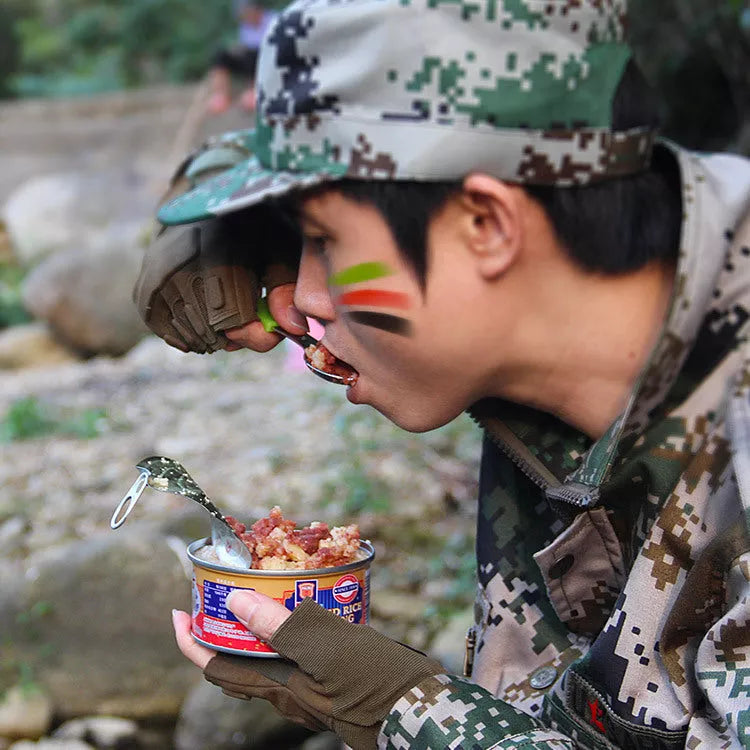 Stainless steel camping utensil set with spoon, fork, knife, and whistle for outdoor adventures