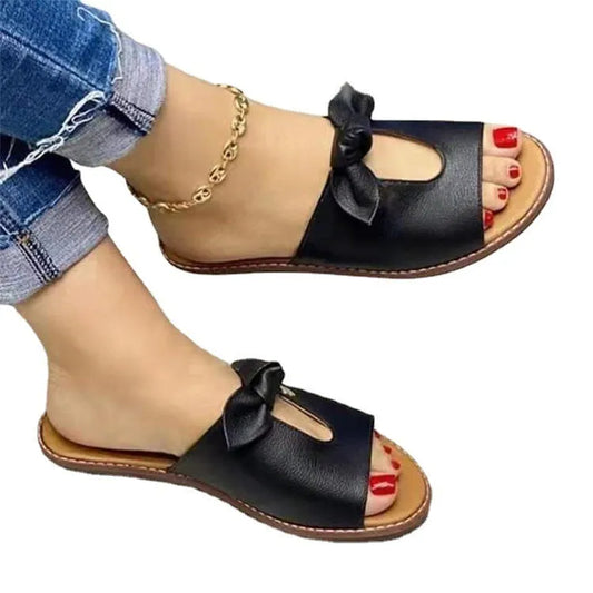 Ladies sandals with bow detailing and fish mouth design in black, pink, or gold colours
