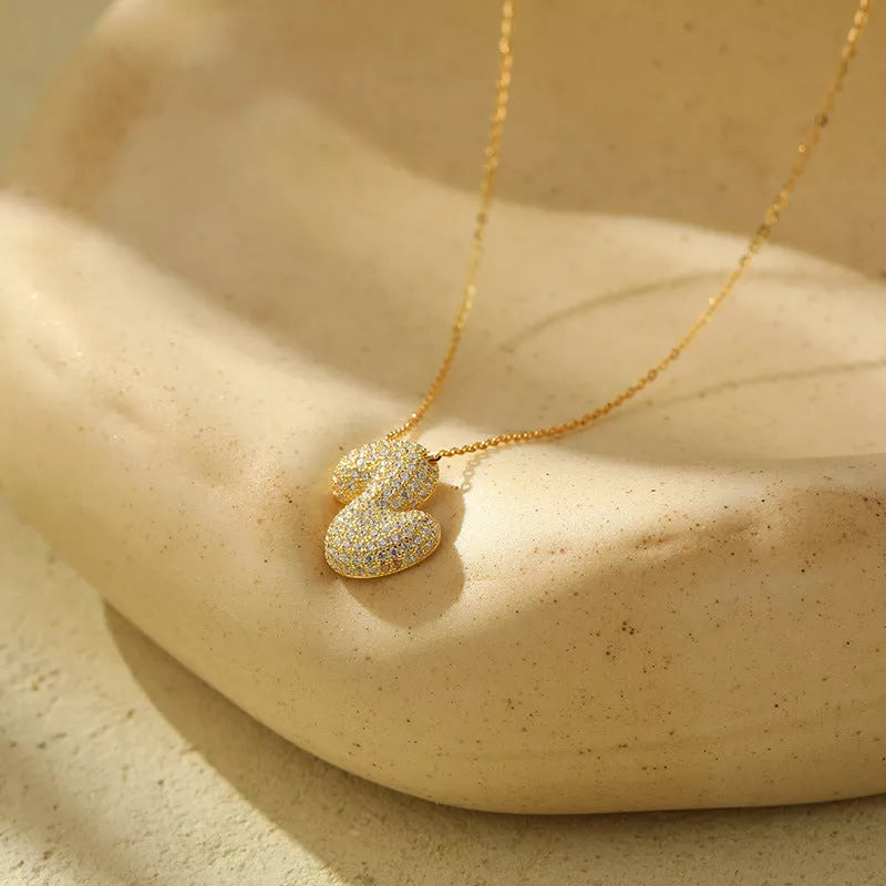 Stainless steel initial pendant necklace with zircon accents, personalized with your choice of letter.