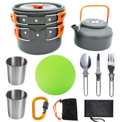 Outdoor camping cookware set with saucepan, frying pan, teapot, and stainless steel cups in mesh storage bag