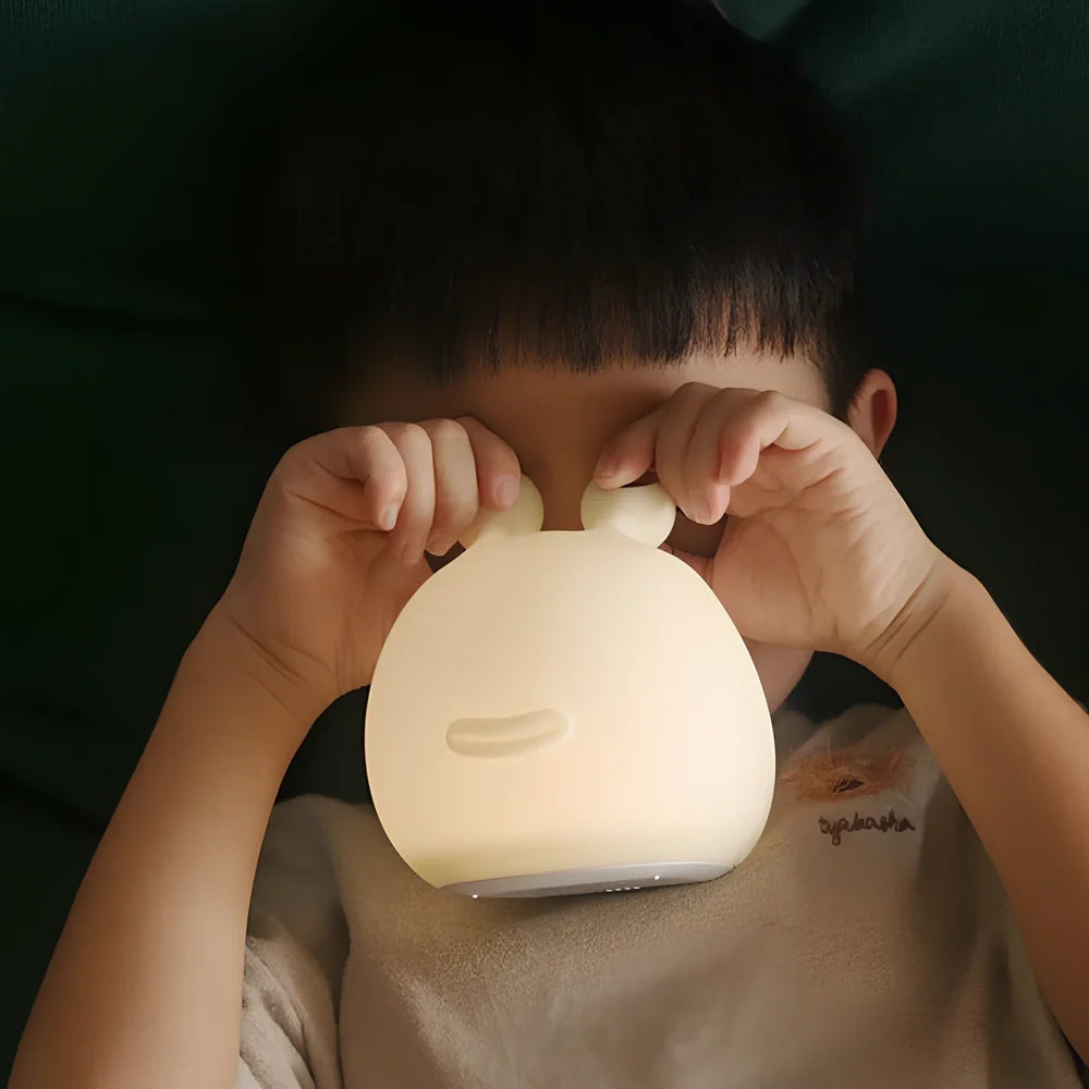 White cartoon slug night light with touch activation and USB power connection