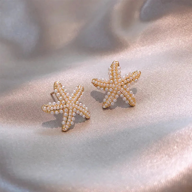 Korean-style women's pineapple starfish pearl alloy earrings with gemstone details in gold, pearl flower, silver, and starfish pearl colours.
