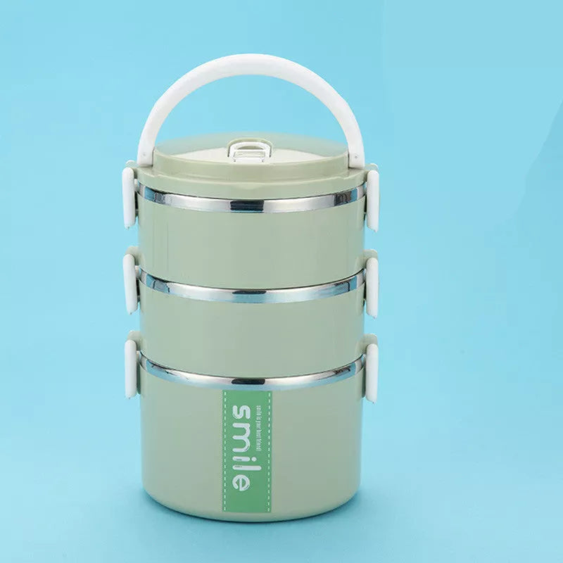 Stainless steel lunch box with built-in spoon, leak-proof design, available in green, pink, and blue