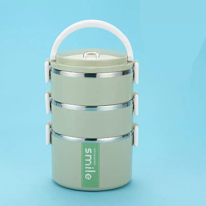Stainless steel lunch box with built-in spoon, leak-proof design, available in green, pink, and blue