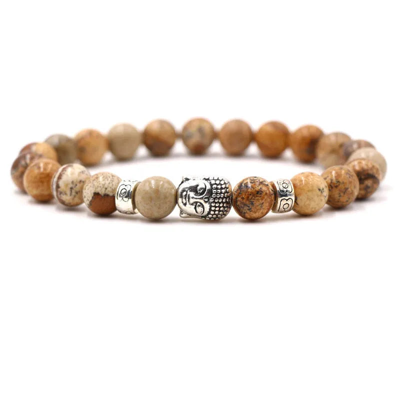 Natural stone stretch bracelet with round beads in various colours including Tigereye and turquoise.