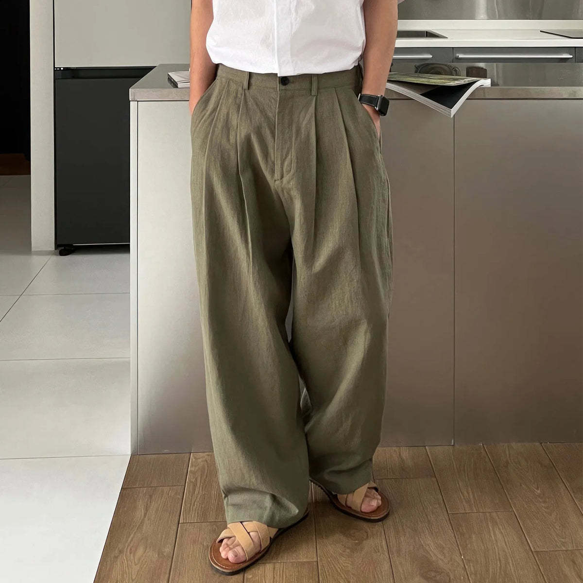 Army Green men's linen-style leisure trousers with a drawstring waist, laid flat.