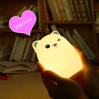 Cartoon silicone night lamp with clap activation in blue or pink, dimensions 100x100x135mm