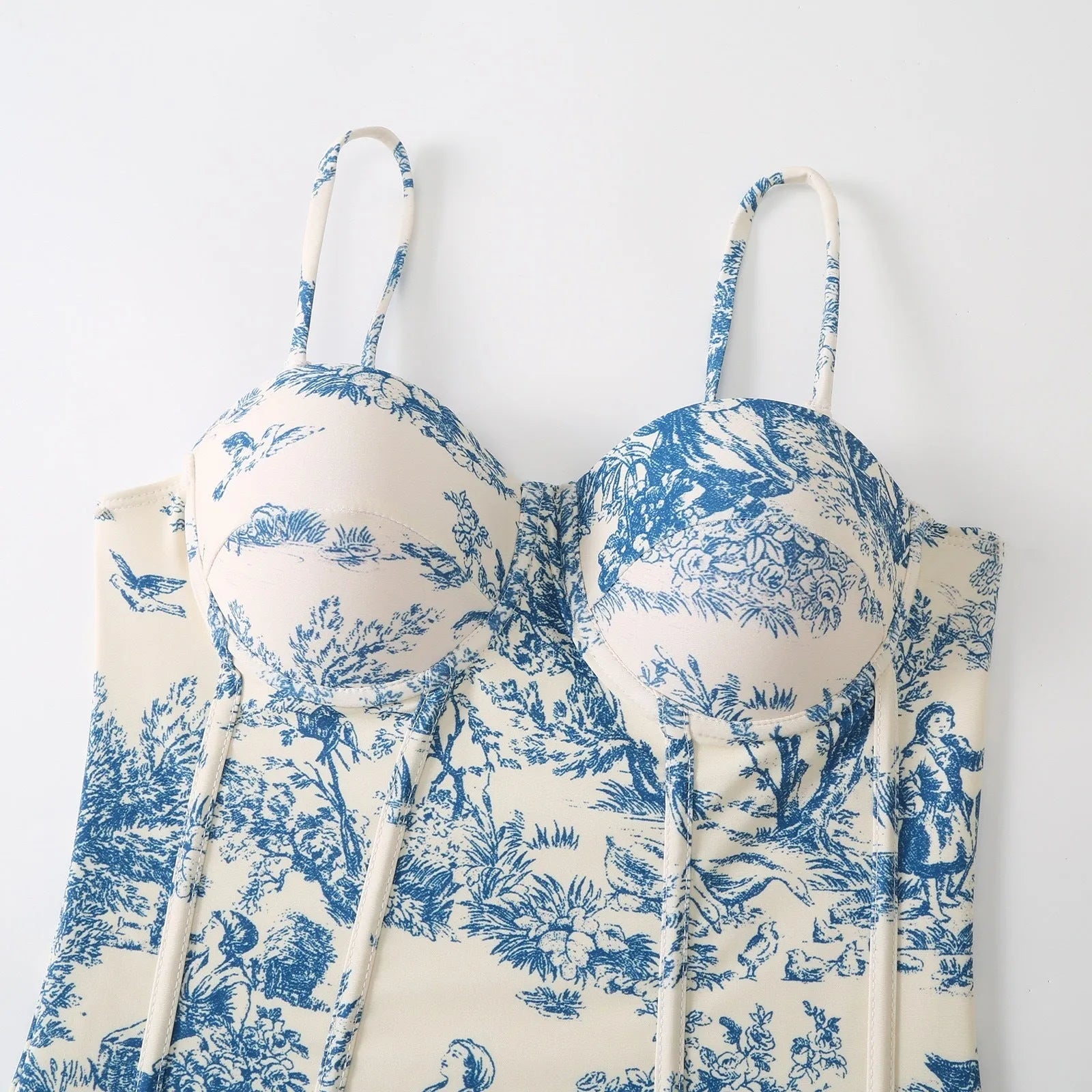 Blue patterned one-piece swimsuit for women with a skirt option.