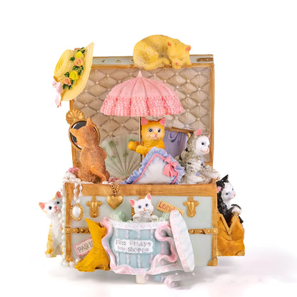Cold porcelain cat-shaped music box with jewellery storage, rotating snowflake light, and mechanical movement