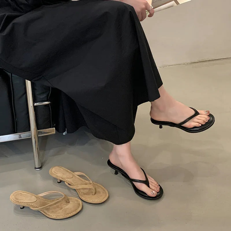 Women's open-toed stiletto sandals in rubber construction showing round toe design