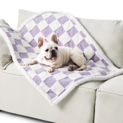 Blue and white patterned waterproof dog blanket on furniture showing cloth texture