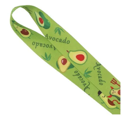 Green avocado cartoon print on a white polyester phone lanyard with a silver buckle.