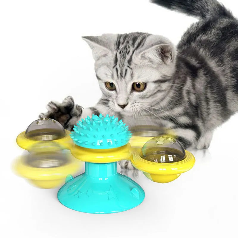 Cat rotating windmill toy with suction base, two transparent bins, blue and yellow-green TPR body.