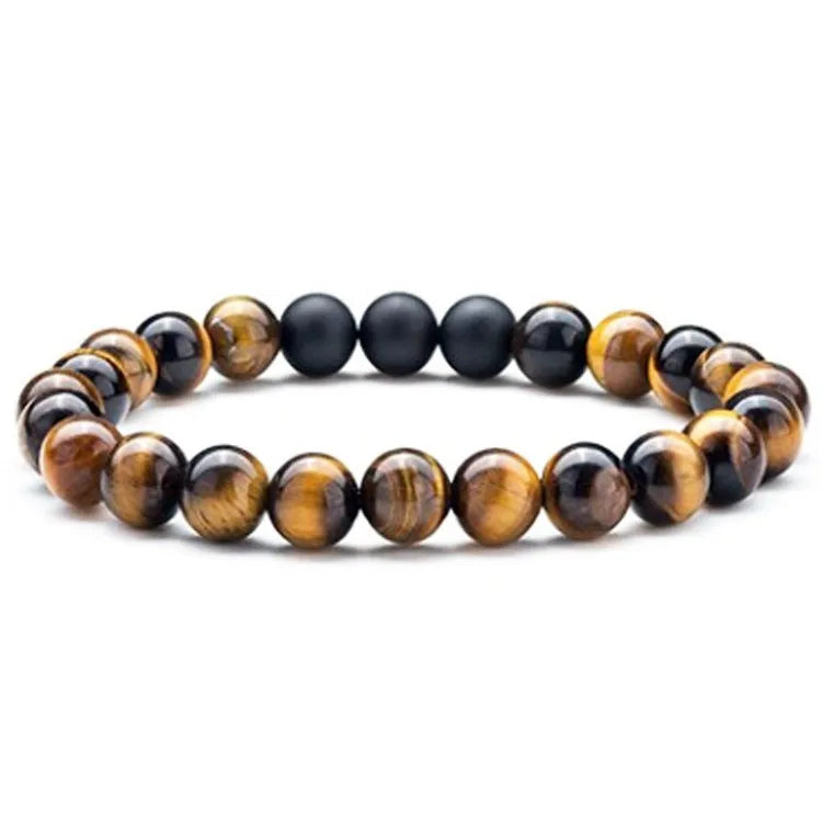 Tiger Eye and black agate geometric couple bracelets laid out as a matching set.
