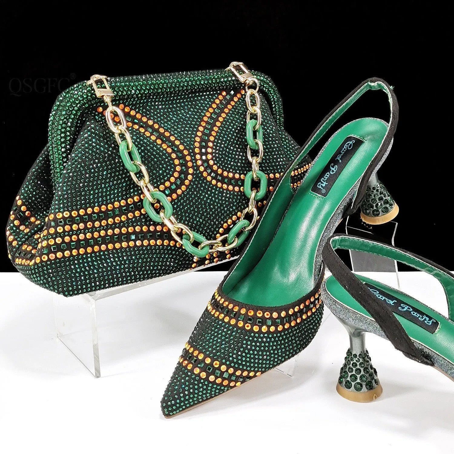Women's pointed toe high heel court shoes in blue with rhinestone detail and a matching small bag.