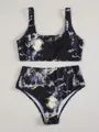 Women's high-waist bikini set with U-neck top in a blue marble tie-dye print.