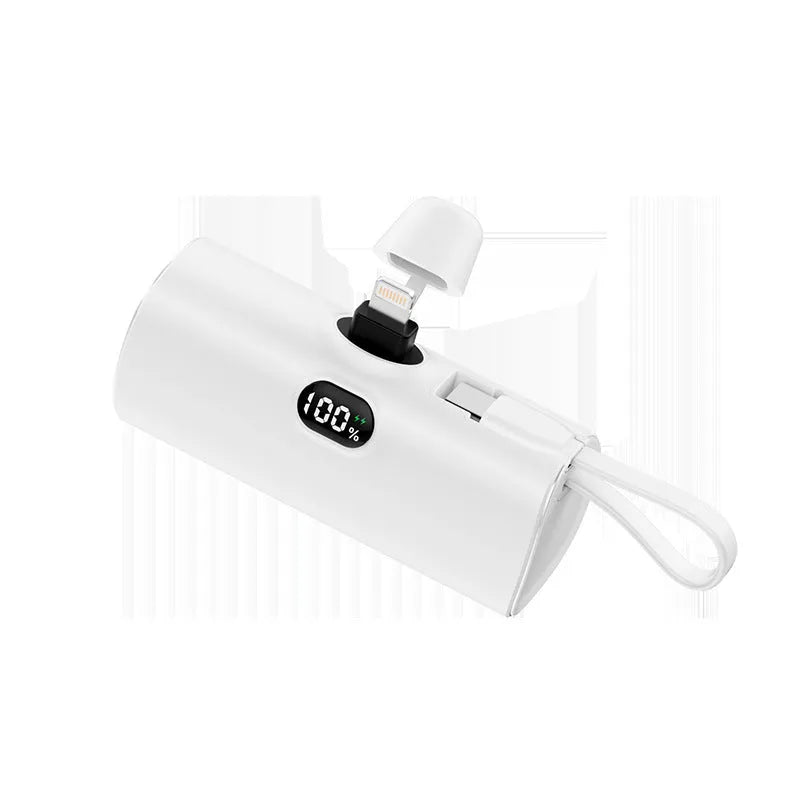 Capsule digital display wireless power bank showing battery percentage on screen, compact 79x34x26mm design with integrated plug