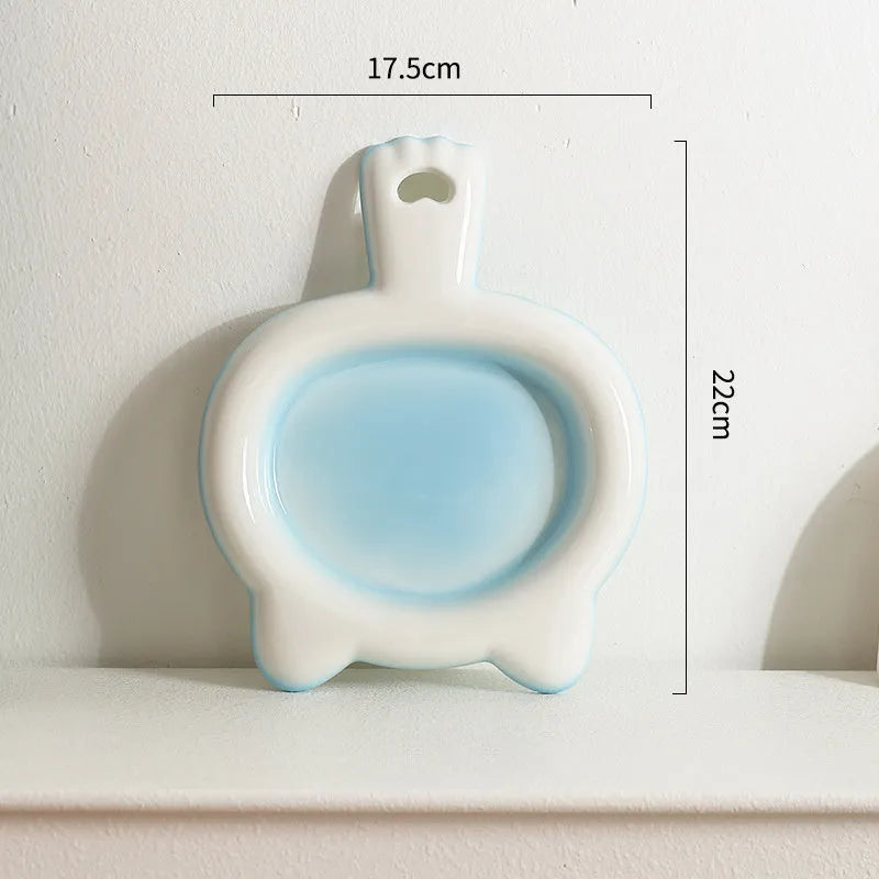 Ceramic cat bowl in blue colour with shallow mouth design for pet food and water.