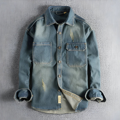 Men's light blue washed vintage denim shirt with long sleeves and a loose cardigan fit.