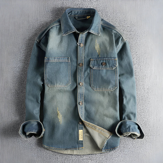 Men's light blue washed vintage denim shirt with long sleeves and a loose cardigan fit.