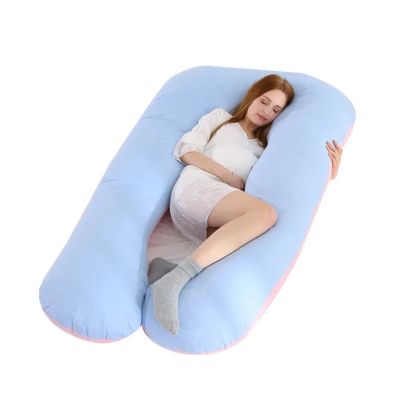 Large U-shaped pregnancy support pillow with removable cover and abdominal support belt.
