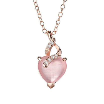 Women's heart-shaped pink crystal pendant necklace with rose gold finish and cross chain
