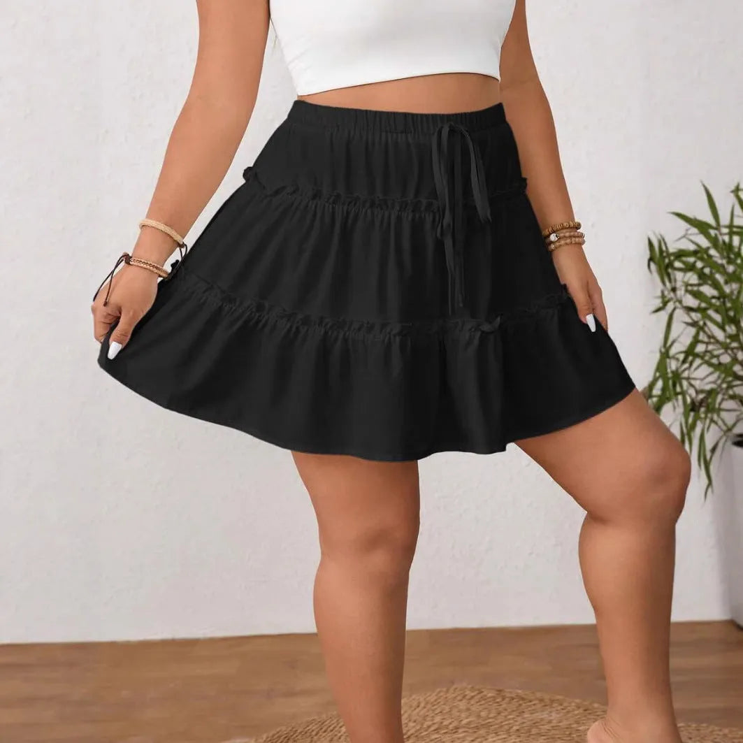 White A-line pleated skirt with adjustable lace-up waist detail, showing micro elasticity fabric and structured pleats