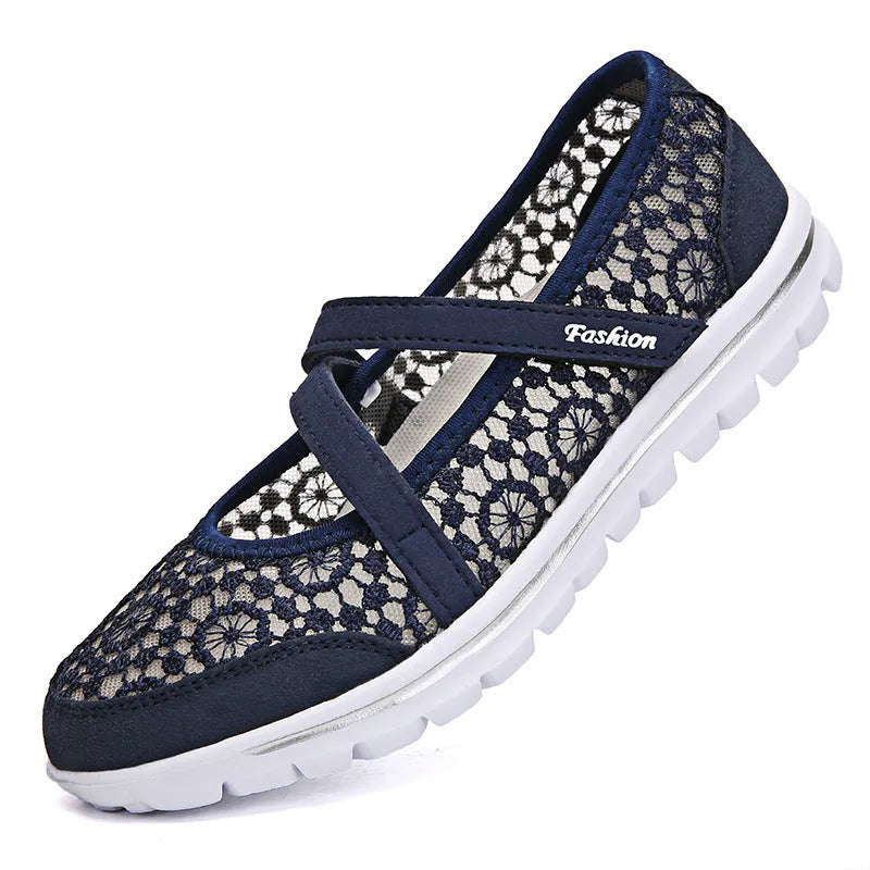 Women's beige mesh lace-up flat shoes with round toe and sewing line detail on a white background.