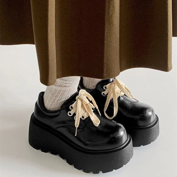 Women's black matte lace-up shoes with 6-8cm English muffin heel and round toe, shown on a neutral background