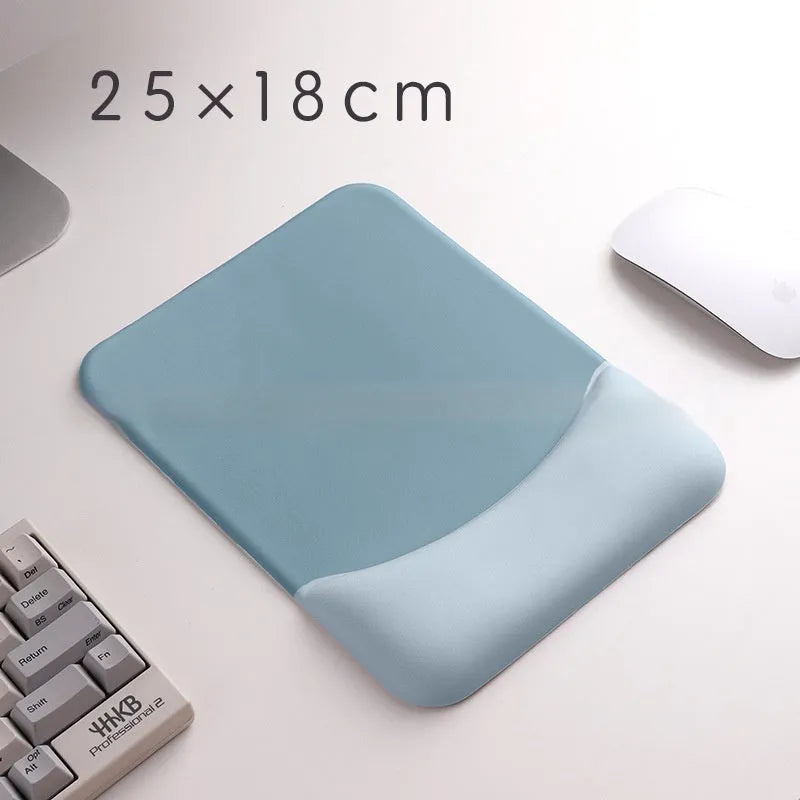 Square cloth mouse pad with grey silicone gel wrist rest and hand pillow on a wooden desk.