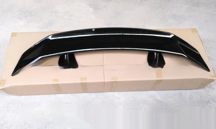 Car punch-free spoiler in ABS plastic showing adhesive mounting surface and finish options
