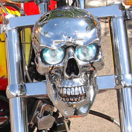 A spooky and stylish LED motorcycle headlight in the shape of a resin skull, perfect for Halloween or adding a unique touch to your daily ride.