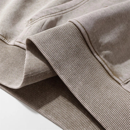 A brown cotton pullover hoodie with an embroidered letter patch design, perfect for casual and comfortable fall fashion.