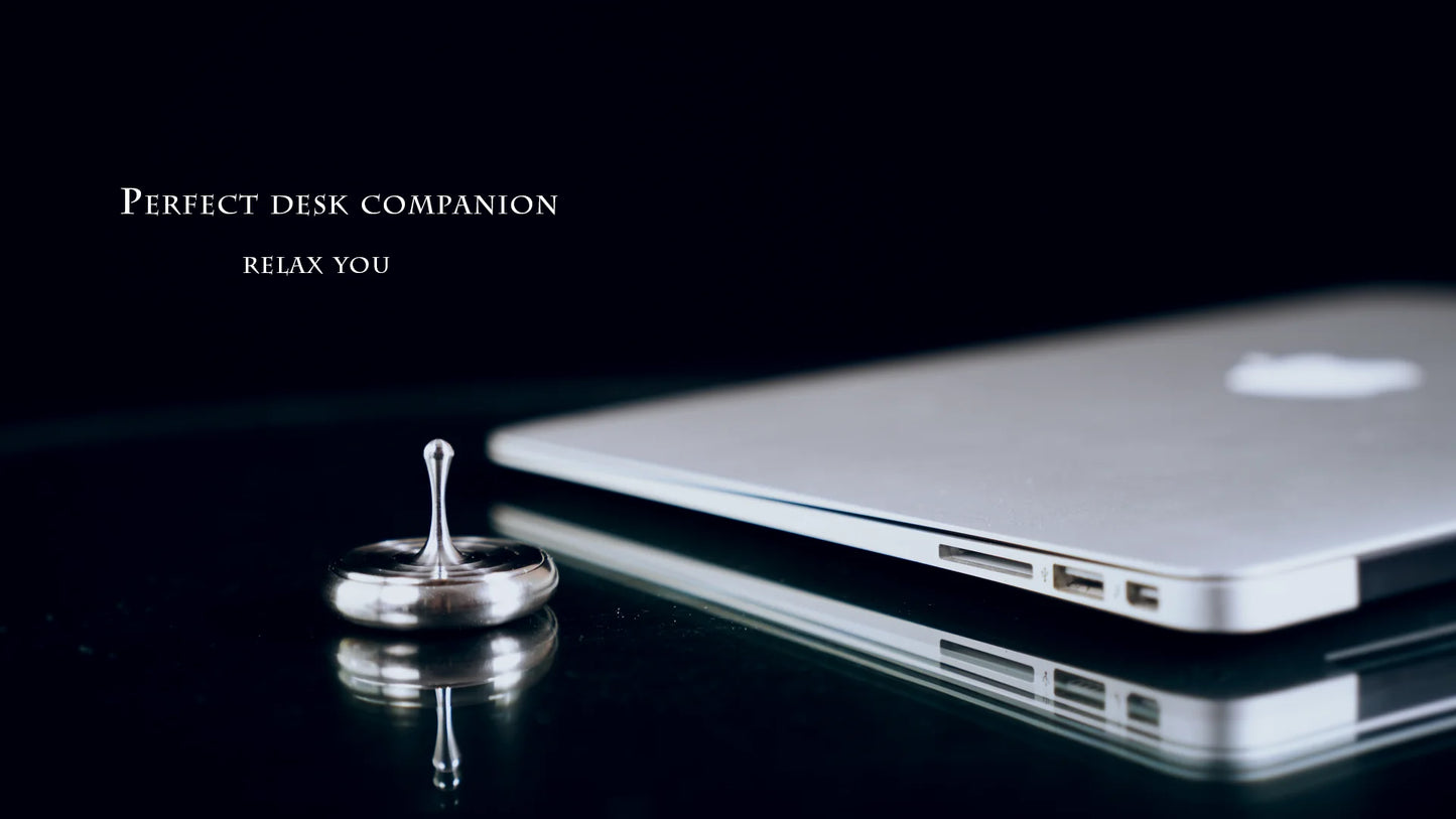 Eternal Rotating Gyroscope - a captivating kinetic art piece that spins for up to 6 minutes, creating a mesmerizing display on your desk or shelf