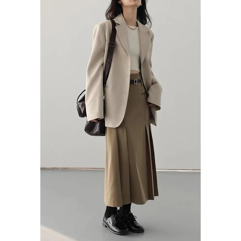 Elegant high-waisted pleated A-line skirt in a neutral color, perfect for office or formal wear