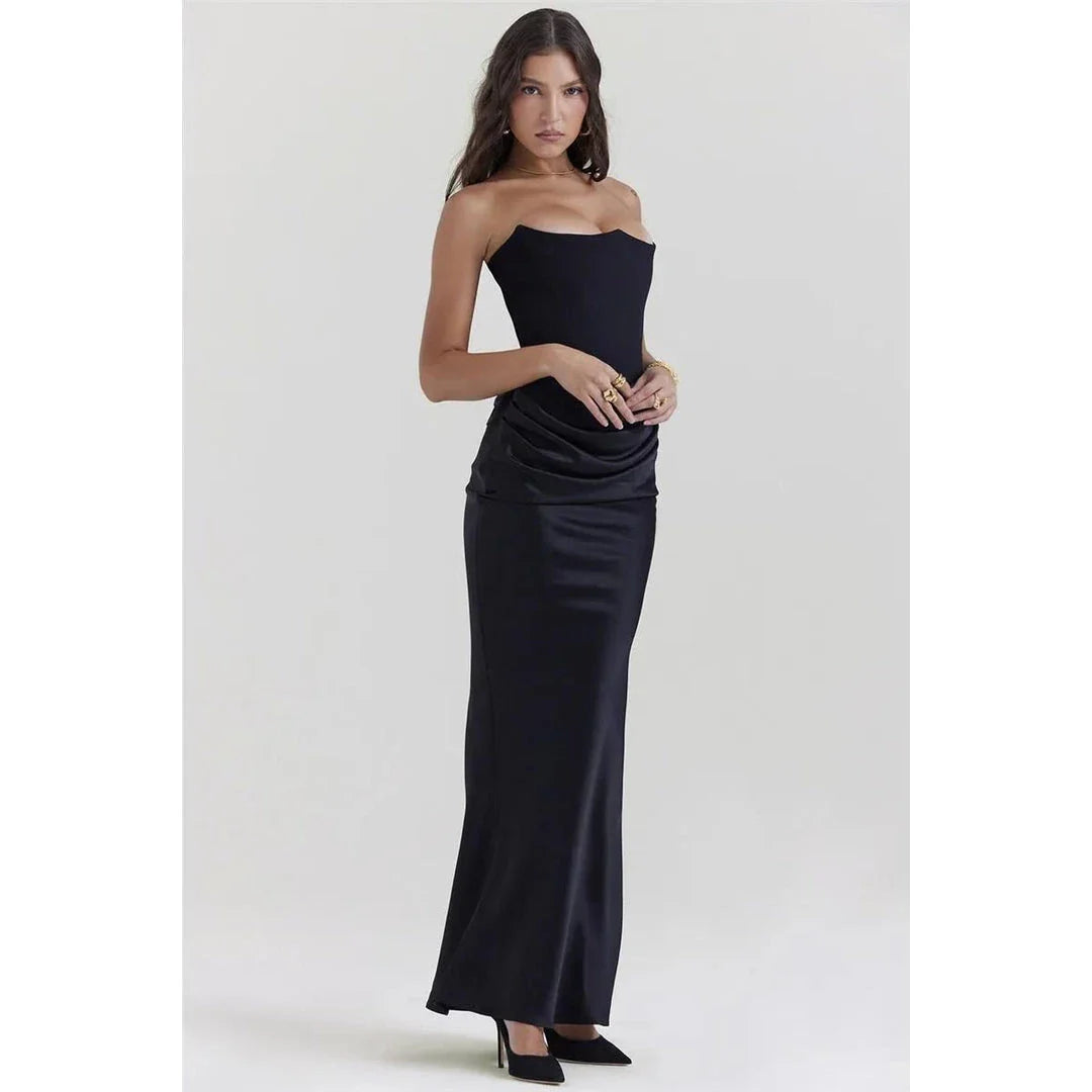 Elegant black strapless backless maxi dress for women, featuring a sleek bodycon silhouette and ankle-length sophistication.