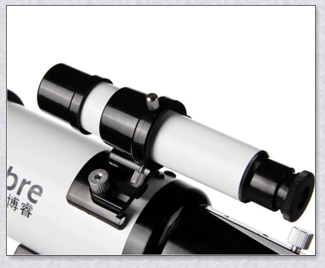 Professional astronomical telescope with adjustable tripod, Barlow lens, and eyepieces for clear, high-resolution views of the night sky