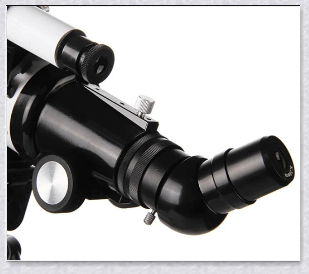 Professional astronomical telescope with adjustable tripod, Barlow lens, and eyepieces for clear, high-resolution views of the night sky