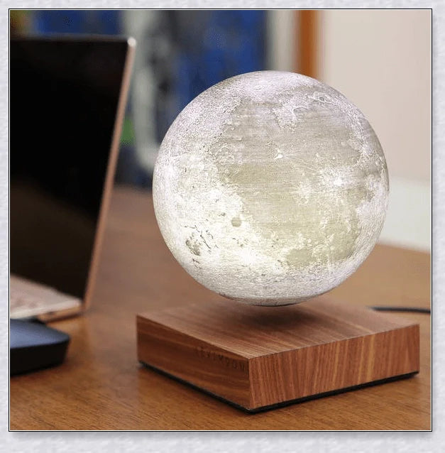 Lunamen - Magnetic Levitating Moon Lamp that rotates and levitates above a magnetic base, displaying the moon's detailed surface.