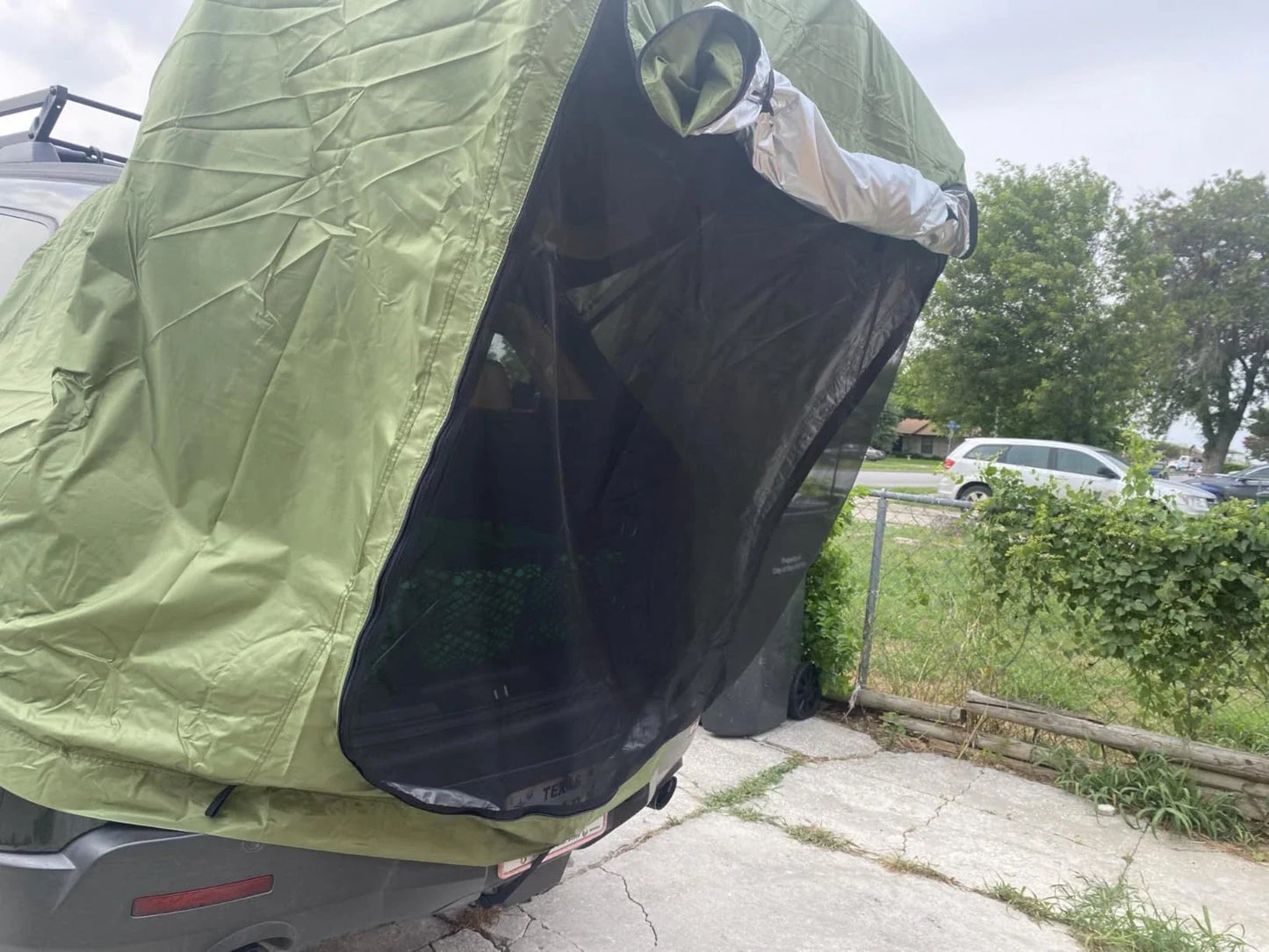 Car Trunk Extension Tent made from durable 210D polyester Oxford fabric with a 2000PU waterproof rating and UV-resistant coating, providing a comfortable and versatile shelter for outdoor adventures.